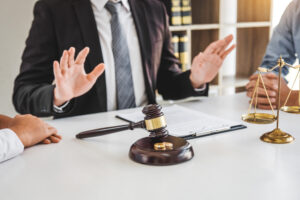 Mediation between marriage, husband and wife during divorce process with male lawyer counselor and signing of divorce contract.